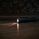 a flashlight sitting on the floor of a room