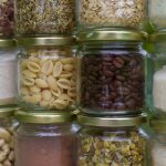 assorted spices in clear glass jars